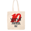 Canvas tote bag with a large red "10" and overlapping black text printed on top that reads "years of Moms."  A small black Moms Demand Action logo is centered under the text.