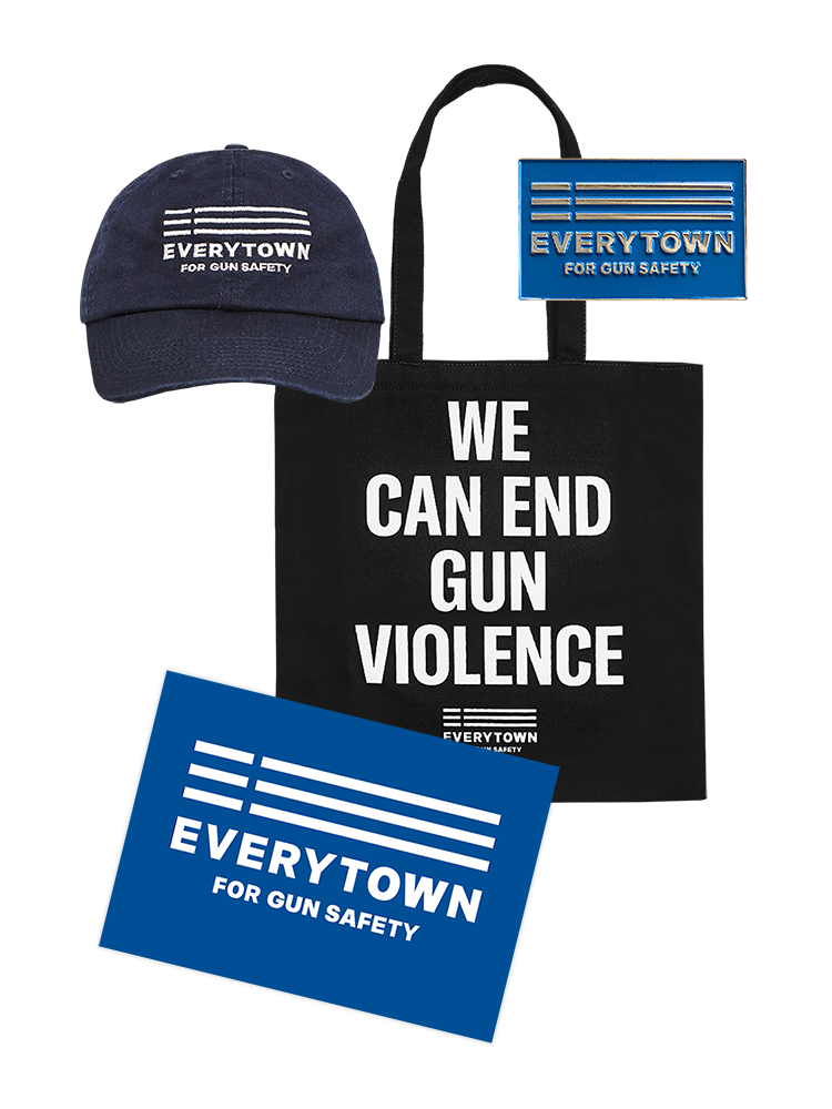 Product image of navy blue ballcap with white embroidered Everytown for Gun Safety logo on front, blue enamel pin with silver Everytown for Gun Safety logo, black tote bag with white, centered, uppercase text that reads: WE CAN END GUN VIOLENCE, with a small white Everytown logo below, and a 11 x 17 inch placard with white Everytown for Gun Safety logo on a blue background.